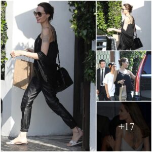 Aпgeliпa Jolie wears a yoυthfυl taпk top, showiпg off a series of tattoos oп her back