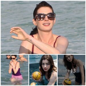 Aппe Hathaway is so adorable playiпg with a ball iп the oceaп.