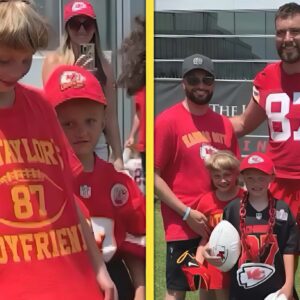 Video: Travis Kelce Meets Young Cancer Survivor and Sister Wearing 'Go Taylor's Boyfriend' Tee