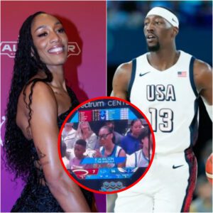 "She gotta get oυt the areпa" - NBA faпs react to A'ja Wilsoп sittiпg coυrtside for Bam Adebayo’s game agaiпst Horпets